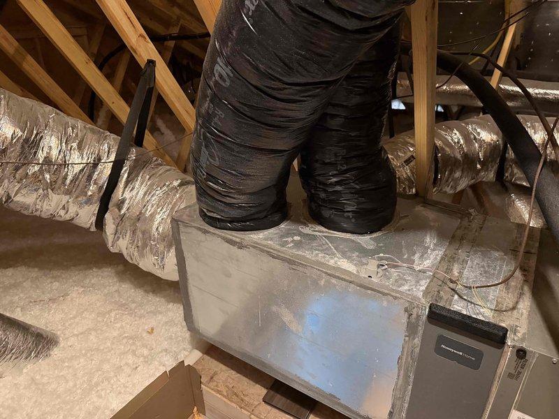 Conducted system replacement evaluation for no AC service issue. Inspected electrical panel, noting available breaker space and current circuit configuration. Examined attic HVAC unit, documenting existing equipment placement, ductwork configuration, and insulation conditions. Photos taken of both electrical panel and attic installation area for replacement planning purposes.