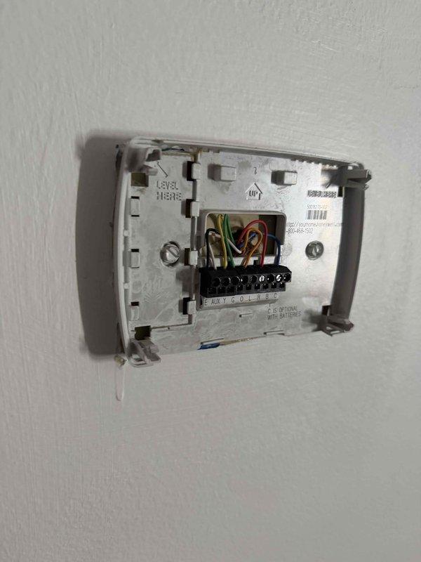 # HVAC Sales Call Summary

Conducted sales consultation for dual-system residential HVAC replacement. Customer requested estimate for upstairs unit replacement along with repair options for comparison purposes. Both systems are aging units (17 and 16 years old). Documented existing thermostat wiring configurations for both zones, photographing terminal connections showing standard color-coded wiring (R, W, Y, G, C terminals) to ensure proper compatibility assessment for replacement equipment recommendations.