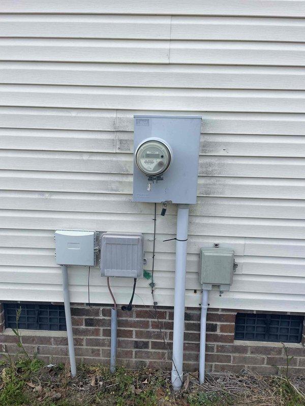 Responded to service call at 1998-built residence for multiple electrical issues including non-functional vent hood, overhead kitchen light, and outlet. Upon arrival, verified no tripped breakers at main panel. Troubleshot kitchen ceiling-mounted LED panel fixture and determined failure due to internal driver malfunction. Inspected range hood circuit and identified loose wire connection at junction box causing intermittent power loss. Investigated problematic outlet that homeowner had previously replaced; testing revealed backstab connection failure and downstream wiring fault causing repeated failure. Removed defective outlet, inspected branch circuit wiring, and discovered damaged conductor with evidence of arcing at wire connection point. Replaced damaged section of wiring, installed new commercial-grade outlet with screw terminal connections for reliable contact, and verified proper grounding. Replaced failed LED panel driver in kitchen ceiling fixture and confirmed proper operatio