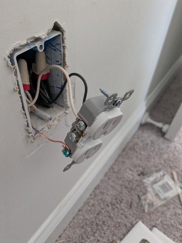 # Electric Service Call Summary

Responded to nuisance tripping on circuit serving Ring doorbell, exterior lighting, and bedroom outlets. Upon inspection, discovered overloaded circuit with multiple high-draw devices on single breaker. 

Performed troubleshooting to isolate fault and determined circuit required reconfiguration. Installed new dedicated circuit for Ring doorbell and exterior lighting to separate load from bedroom receptacles. Ran new wiring through wall cavity and installed additional electrical box. Terminated all connections per NEC standards with proper wire nuts and secured all conductors. Replaced damaged outlet in bedroom with new tamper-resistant receptacle and repaired drywall opening around electrical box.

Verified all circuits operational with no tripping under normal load conditions. Tested Ring doorbell, exterior lights, and bedroom outlets independently to confirm proper voltage and functionality. Reset breaker panel and confirmed all connections tight and 