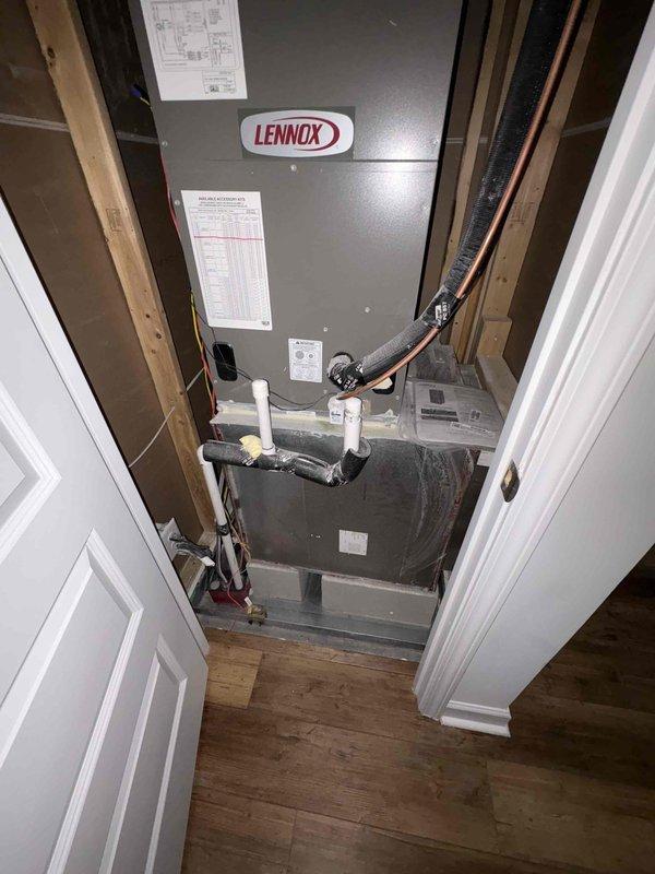 Completed comprehensive tune-up service on two 4-year-old Lennox HVAC systems. Performed standard maintenance procedures including inspection of air handler components, capacitor testing, refrigerant line examination, electrical connections verification, and condensate drain line assessment. Documented system conditions with interior and exterior unit photography, noting all components operational at time of service with proper insulation and wiring connections intact.
