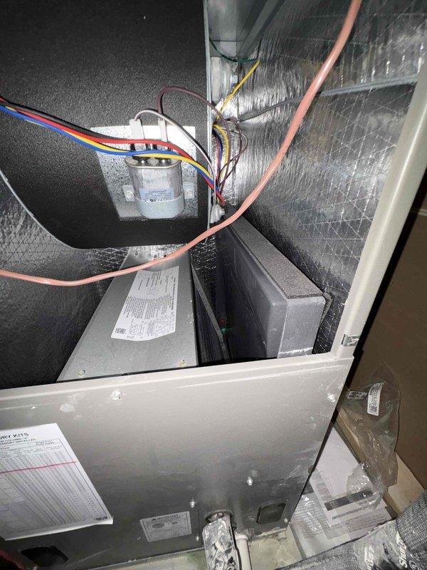 Completed comprehensive tune-up service on two 4-year-old Lennox HVAC systems. Performed standard maintenance procedures including inspection of air handler components, capacitor testing, refrigerant line examination, electrical connections verification, and condensate drain line assessment. Documented system conditions with interior and exterior unit photography, noting all components operational at time of service with proper insulation and wiring connections intact.