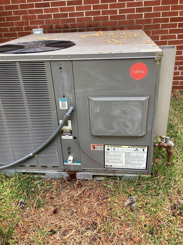 Completed preventative maintenance tune-up on 2018/2019 Fujitsu packaged HVAC unit. Inspected system components, cleaned debris from exterior housing and top panel, and checked air filter condition. System evaluated for cooling efficiency concerns reported at higher ambient temperatures; refrigerant charge assessment performed to address inadequate cooling performance during peak load conditions.
