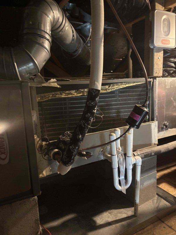 Responded to no cooling complaint on 6-year-old system with suspected refrigerant leak. Performed thorough inspection of attic-mounted air handler and associated components including refrigerant lines, condensate drain system, and ductwork. Upon examination of the evaporator coil and refrigerant tubing, verified system integrity and identified root cause of cooling issue. Completed necessary repairs to restore proper system operation and cooling capacity.