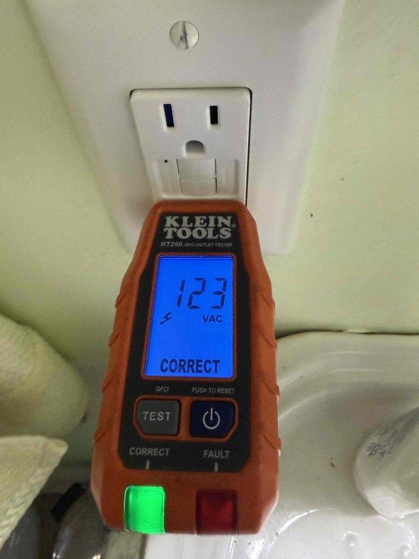 Installed GFCI receptacles in the master bathroom, replaced existing GFCI in hall bathroom, installed GFCI protection for kitchen countertop outlets, and installed GFCI for washing machine circuit. Provided and installed three wireless interconnected smoke detectors in bedrooms and one hardwired smoke/CO combination detector in the hallway with wireless communication capability to integrate with bedroom units. Verified proper operation of all GFCI devices using outlet tester, confirming correct wiring and ground fault protection functionality.