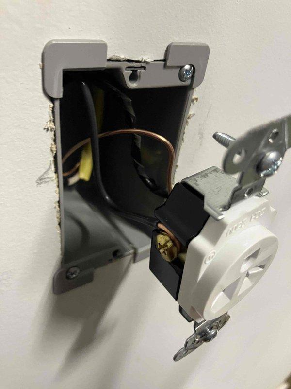 Installed a dedicated 240-volt circuit for electric vehicle charging capability in the garage of a 1999 home. Ran new wiring from the exterior main electrical panel through the wall to a new outlet installation point, utilizing appropriate gauge conductors for EV charging loads. Mounted and wired a NEMA outlet in a metal electrical box within the garage, ensuring proper grounding and secure connections for safe high-amperage operation.