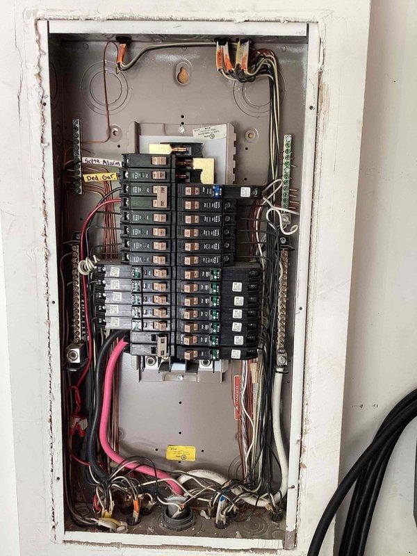 Completed comprehensive 32-point electrical system evaluation and preventative maintenance on 2015 residential property. Performed electrical panel maintenance including torque verification and connection inspection of all breakers and conductors within the main service panel. Conducted testing of all GFCI shock protection outlets and breakers to verify proper ground fault protection functionality. Tested all AFCI fire protection breakers to ensure arc fault detection systems operating within manufacturer specifications. Performed smoke and carbon monoxide detector maintenance including battery replacement and functional testing of all units. Replaced customer-supplied light bulbs in fixtures up to 12 feet and cleaned ceiling fans up to 12 feet. Documented Trane XR outdoor HVAC unit (Model 4TWR4024E1000BA, manufactured April 2015) during coordinated service visit. All electrical safety devices tested and verified operational, panel connections properly torqued to specifications, and al