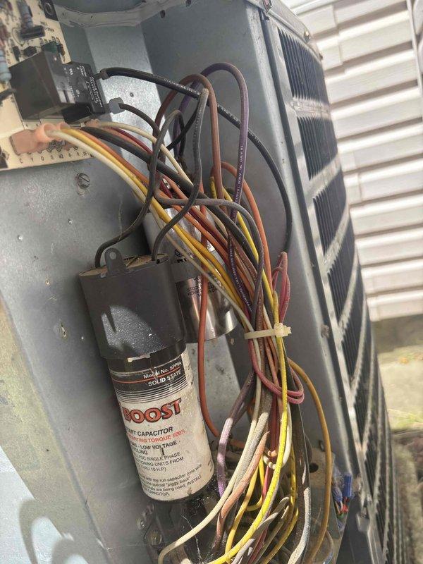 Responded to no cooling complaint on 6-year-old single-zone HVAC system with mechanical thermostat. Upon inspection, diagnosed failed capacitor in outdoor condensing unit preventing compressor operation. Replaced defective dual-run capacitor with OEM-equivalent component, restored proper electrical connections, and verified system cooling operation with temperature differential readings within manufacturer specifications.