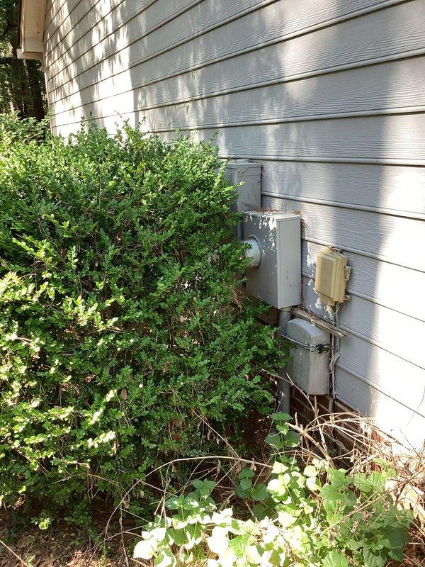 Responded to non-functioning exterior porch light controlled by interior living room switch. Verified breaker was operational and removed wall plate to access triple switch assembly. Diagnosed faulty switch in the three-gang box, identified correct wiring connections (black, white, and red conductors), and replaced defective switch. Tested operation and confirmed exterior light now functions properly when toggled from interior switch location.