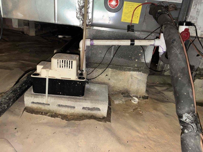 Responded to scheduled appointment for 16-year-old HVAC system with failed compressor. Assessed existing equipment located in crawl space, including air handler, condensate pump, and associated ductwork and refrigerant lines. Documented current system configuration with photographs showing aged unit with deteriorated components, existing flexible ductwork, copper line sets, electrical connections, and crawl space conditions including vapor barrier and concrete foundation. Provided customer with replacement options and recommendations for complete system replacement due to age of equipment and compressor failure.