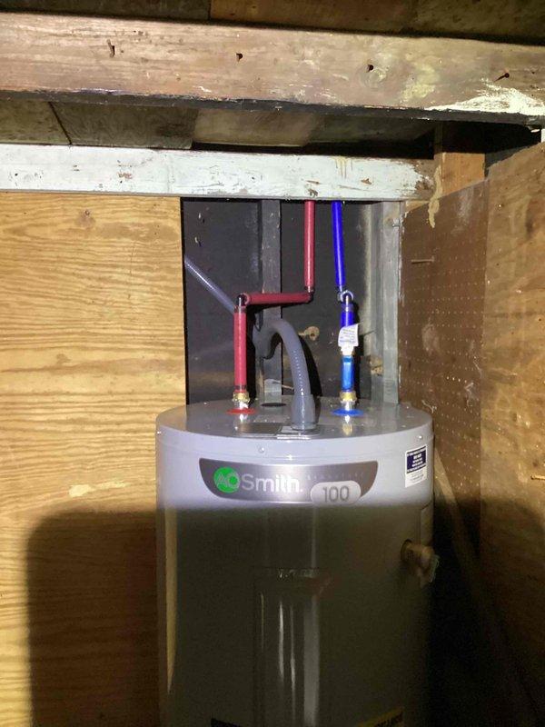 Converted existing 110V electrical outlet to 240V circuit for relocated A.O. Smith water heater installation in residential basement crawl space. Installed appropriate gauge wiring, upgraded circuit breaker, and verified proper grounding and voltage supply to accommodate new water heater electrical requirements.