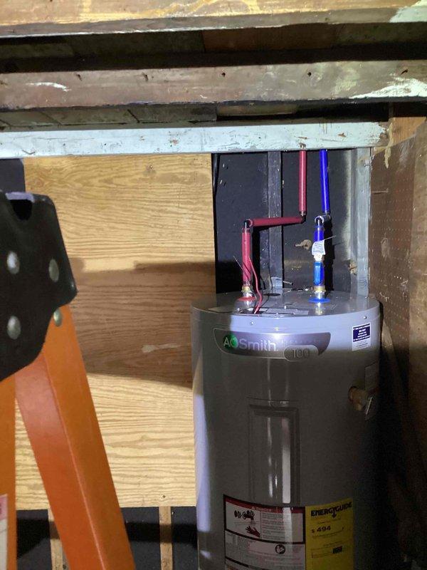 Converted existing 110V electrical outlet to 240V circuit for relocated A.O. Smith water heater installation in residential basement crawl space. Installed appropriate gauge wiring, upgraded circuit breaker, and verified proper grounding and voltage supply to accommodate new water heater electrical requirements.