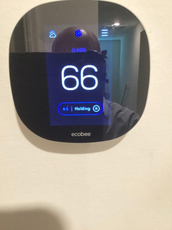 Responded to no-cool complaint on 5-year-old split-level system where upstairs zone was not reaching setpoint while downstairs operated normally. Upon arrival, verified ecobee thermostat was calling for cooling with setpoint at 65°F but space temperature reading 66°F, indicating insufficient cooling capacity to upper level. Conducted system diagnostics to identify cause of inadequate cooling performance to affected zone.