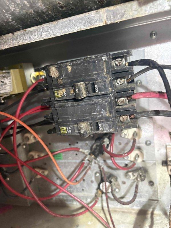 Responded to service call for reported electrical burning smell when HVAC system operates on 19-year-old single-zone unit. Upon inspection, discovered severely contaminated blower motor and squirrel cage fan assembly with excessive dust and debris accumulation throughout blower housing. Electrical panel inspection revealed signs of age-related wear, corrosion, and oxidation on breaker connections and metal surfaces. Documented conditions with photographs showing heavy buildup on blower components and deteriorated electrical connections. Advised customer of findings and safety concerns related to compromised electrical components and restricted airflow due to contamination. Recommended immediate cleaning of blower assembly and evaluation of electrical connections to eliminate fire hazard and restore safe system operation.