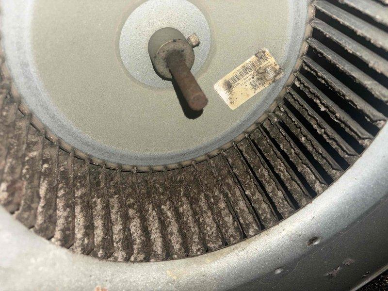 Responded to service call for reported electrical burning smell when HVAC system operates on 19-year-old single-zone unit. Upon inspection, discovered severely contaminated blower motor and squirrel cage fan assembly with excessive dust and debris accumulation throughout blower housing. Electrical panel inspection revealed signs of age-related wear, corrosion, and oxidation on breaker connections and metal surfaces. Documented conditions with photographs showing heavy buildup on blower components and deteriorated electrical connections. Advised customer of findings and safety concerns related to compromised electrical components and restricted airflow due to contamination. Recommended immediate cleaning of blower assembly and evaluation of electrical connections to eliminate fire hazard and restore safe system operation.