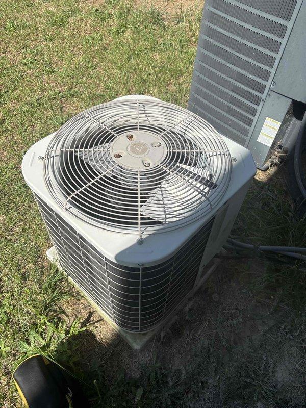 Responded to no cool call on downstairs air conditioning system struggling to maintain set temperature. Inspected outdoor condenser unit and measured system temperatures, recording 63.8°F at refrigerant lines. Performed diagnostic assessment of approximately 5-6 year old split system to determine cooling capacity issues.