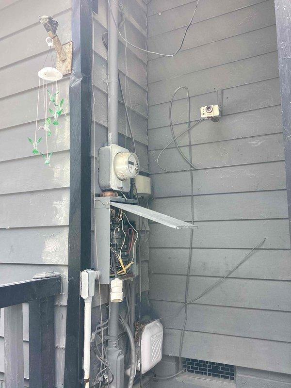 Responded to complete loss of power at 1962 residence where main breaker had tripped and was running hot to the touch. Upon inspection, found outdated electrical service panel with signs of age, dust accumulation, and disorganized wiring throughout the enclosure. Main breaker exhibited overheating due to deteriorated connections and excessive resistance at terminal points. Determined that the aging panel components and inadequate wire terminations were causing the thermal event. Reset main breaker after allowing cooling period and verified proper voltage at meter base and distribution panel. Inspected all branch circuit breakers for similar thermal stress and tested connections. Advised that the entire service panel requires replacement due to age-related deterioration, outdated components, and safety concerns related to the overheating main breaker. Restored temporary power to residence but strongly recommended immediate panel upgrade to prevent recurring outages and potential fire ha
