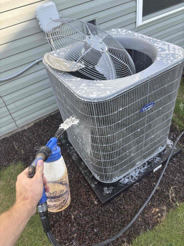 Completed comprehensive heating and air maintenance on single-unit new construction system. Performed 80-point inspection covering all major components and operational parameters. Cleaned outdoor condenser coils using professional coil cleaner solution to remove debris and restore optimal heat transfer efficiency. Conducted burner cleaning and adjusted gas pressures to manufacturer specifications. Verified proper operation of Carrier outdoor unit and Aatroncom zone control system. Completed all safety inspections with system operating within normal parameters.