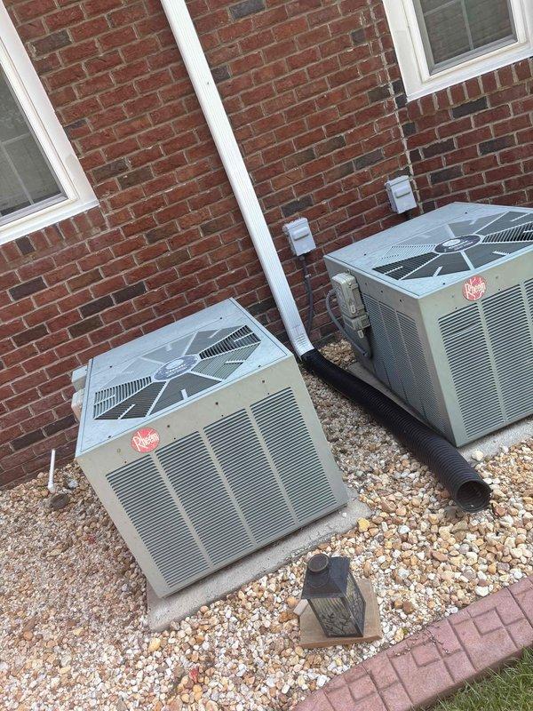 Responded to no cooling call on downstairs unit of a two-system residence with 20-year-old equipment. Upon arrival, performed diagnostic testing on the affected Rheem condensing unit using multimeter, which revealed a compressor issue with abnormal electrical readings of 86.61 ohms. Unit was blowing air but compressor was not operating, confirming customer's report of no cooling condition.