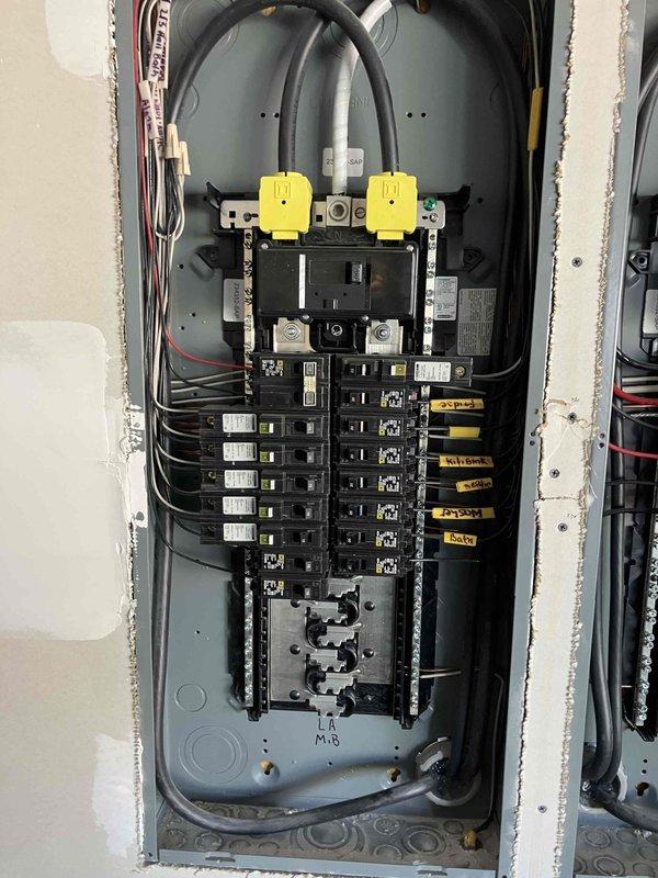 Responded to reports of power surges affecting multiple systems throughout the residence, including intermittent WiFi connectivity, hard-wired smoke detectors cycling on and off, and GFCI receptacles exhibiting abnormal blinking behavior. Performed comprehensive electrical safety evaluation of the main service panel and associated components. Inspected main breaker assembly, neutral bus bar connections, and circuit breaker integrity to identify potential sources of voltage fluctuations and power quality issues affecting sensitive electronic equipment and life safety systems.