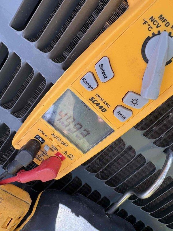 Responded to no cooling call on 8-year-old single system. Upon arrival, performed diagnostic testing of outdoor unit using digital multimeter. Measured capacitance reading of 400.9 MFD and amperage draw of 294.7 on compressor circuit, indicating potential electrical issues affecting system operation. Customer also reported inadequate airflow to guest bedroom prior to complete system failure, suggesting possible secondary issue with ductwork or zoning that will require further evaluation once primary cooling issue is resolved.