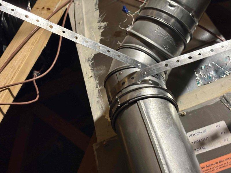 Completed comprehensive heating and air maintenance on 2019 HVAC system including full 80-point inspection on both heating and cooling components. Performed outdoor coil cleaning, burner cleaning, and adjusted gas pressures to manufacturer specifications. Conducted thorough safety inspections of all system components. Inspected ductwork installation in attic space, verifying proper support strapping and secure mounting to ceiling joists. Examined electrical components including capacitor rated at 5 microfarads, confirming proper operation and connections. All systems operating within normal parameters upon completion of maintenance service.