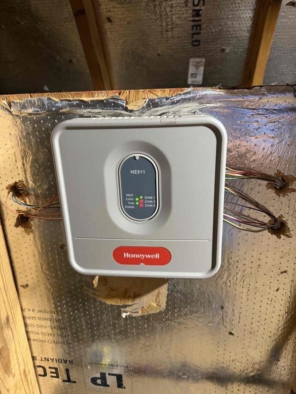 Conducted sales consultation for complete HVAC system replacement on existing 2016 equipment. Evaluated current single-zone system with Honeywell zone control panel installed in attic space, assessed exterior condensing unit and associated line sets with weatherproof disconnect, and documented existing installation configuration. Provided replacement options for both furnace and air conditioning equipment to homeowner.