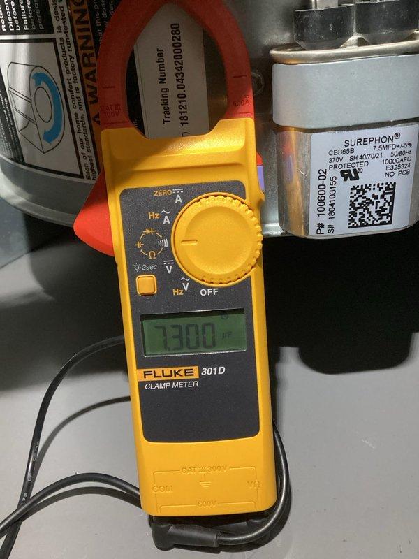 Responded to no cooling call on 7-year-old system unable to maintain temperature below 76 degrees. Upon arrival, performed diagnostic testing using clamp meter to measure electrical draw and checked capacitor operation. Found failed run capacitor causing compressor to draw improper amperage. Replaced defective SUREPHON5 capacitor with manufacturer-specified unit. Verified proper electrical values, confirmed compressor operation, and tested system cooling performance. Unit now operating within normal parameters and achieving set temperature. Also referenced zone panel wiring diagram for TrueZONE H2432 conventional system to verify proper damper and thermostat connections during troubleshooting process.