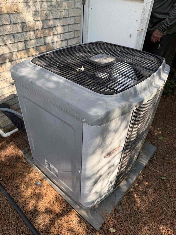 Performed sales consultation for replacement of 22-year-old HVAC system consisting of outdoor condensing unit and crawlspace-mounted air handler. Documented existing equipment configuration including flexible ductwork, PVC condensate drainage, and electrical connections in crawlspace installation. Homeowner specifically requested Carrier equipment with 17-18 SEER variable speed compressor and variable speed air handler, though noted previous preference for Trane brand based on past experience.