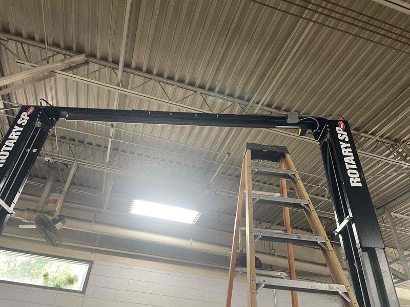 Conducted site assessment for electrical service upgrade to accommodate new lift installation in commercial facility with exposed truss ceiling structure. Evaluated existing electrical infrastructure and performed load calculations to determine circuit requirements for lift equipment extension. Documented current conditions including overhead structural layout, equipment placement, and available power distribution points to develop comprehensive quote for extending wiring circuits and integrating new lift system into facility's electrical service.