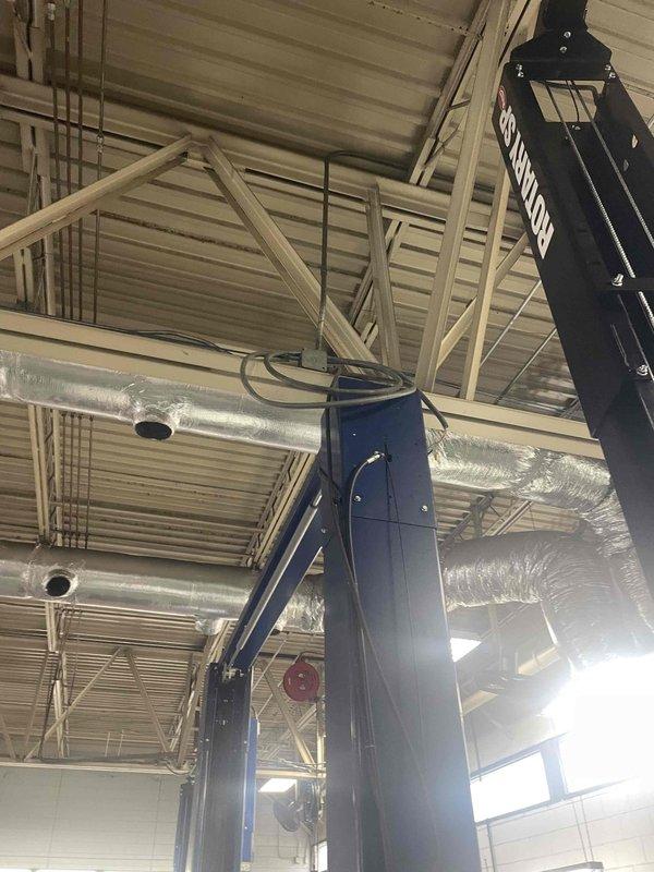 Conducted site assessment for electrical service upgrade to accommodate new lift installation in commercial facility with exposed truss ceiling structure. Evaluated existing electrical infrastructure and performed load calculations to determine circuit requirements for lift equipment extension. Documented current conditions including overhead structural layout, equipment placement, and available power distribution points to develop comprehensive quote for extending wiring circuits and integrating new lift system into facility's electrical service.