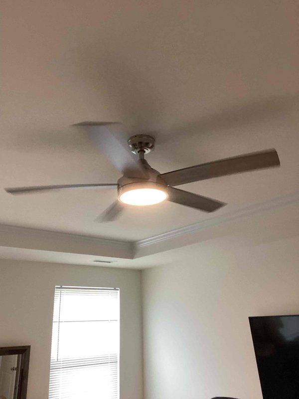Removed existing light fixture from first-floor bedroom ceiling and confirmed proper fan-rated electrical box was present. Installed new ceiling fan with integrated light fixture, connecting all electrical wiring to manufacturer specifications. Verified fan operation, light functionality, and proper blade clearance on standard height ceiling, ensuring safe and secure mounting above sleeping area.
