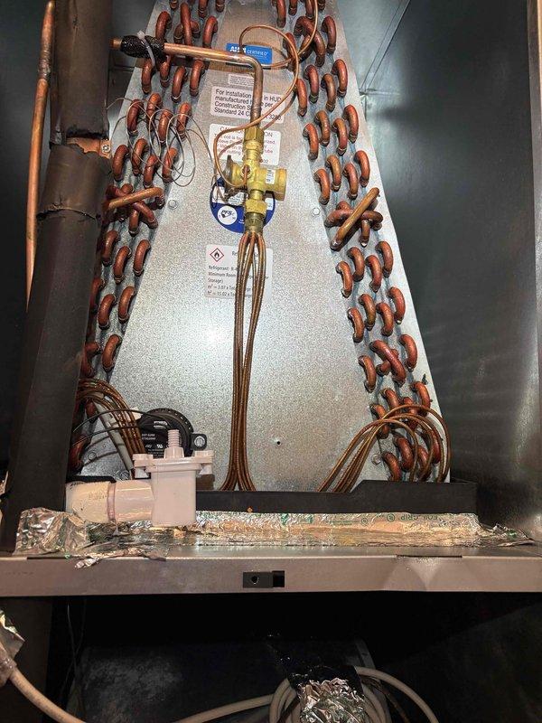 Responded to callback for insufficient airflow to rear zones of residence, specifically master bedroom experiencing extended cooling times on system installed approximately five months prior. Performed visual inspection of air handler and inverter control board to assess system operation and identify potential airflow restrictions or equipment deficiencies related to possible recall conditions. Documentation completed with photographic evidence of internal components for warranty evaluation.