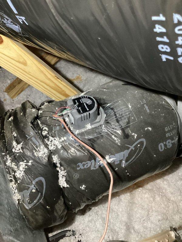 # HVAC No Cool Service Call

Responded to no cooling complaint on 2020 central air system with intermittent zone damper operation. Upon arrival, confirmed thermostat calling for cooling but motorized damper failing to open, with no indicator lights illuminated on damper actuator. Inspected air handling unit and discovered blower motor assembly heavily contaminated with insulation debris and dust accumulation, restricting airflow and potentially affecting system controls. Removed blower motor from air handler for cleaning and inspection. Performed system diagnostics using digital testing equipment to verify electrical connections and control voltage at damper actuator and zone control panel. Measured supply air temperatures and verified refrigerant pressures at condensing unit. Identified failed damper actuator as root cause of intermittent operation. Cleaned blower motor assembly, removing accumulated insulation fibers and debris from motor housing and surrounding components. Checked c