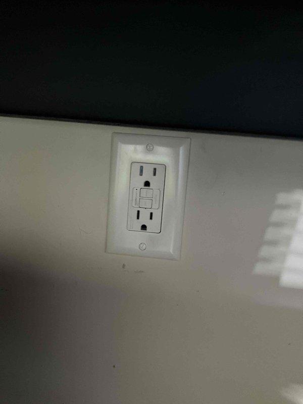 Responded to multiple non-functioning outlets in garage and exterior of 2012 home. Verified breaker panel showed no tripped circuits. Located and installed GFCI outlet to provide required ground fault protection for garage circuits, including outlet serving refrigerator. Addressed wiring connections at ceiling junction box to restore power to affected outlet circuits. All garage and exterior outlets tested and confirmed operational upon completion.