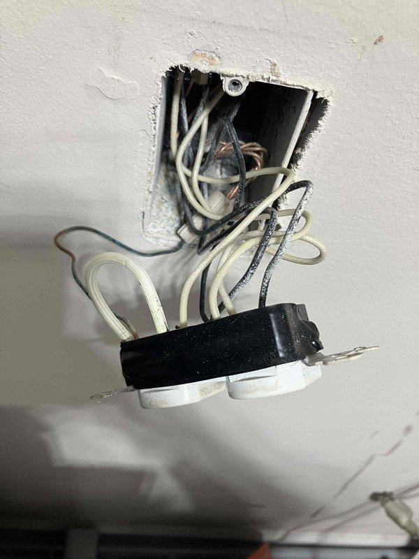 Responded to multiple non-functioning outlets in garage and exterior of 2012 home. Verified breaker panel showed no tripped circuits. Located and installed GFCI outlet to provide required ground fault protection for garage circuits, including outlet serving refrigerator. Addressed wiring connections at ceiling junction box to restore power to affected outlet circuits. All garage and exterior outlets tested and confirmed operational upon completion.