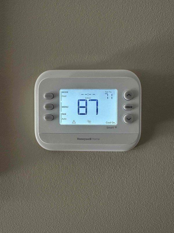 Completed HVAC system installation with new Honeywell Home digital thermostat programmed and operational in cooling mode. Installed Kidde Carbon Monoxide Alarm as required safety device to meet code compliance. All equipment tested and verified functioning properly with customer walkthrough of thermostat operation and alarm features provided.