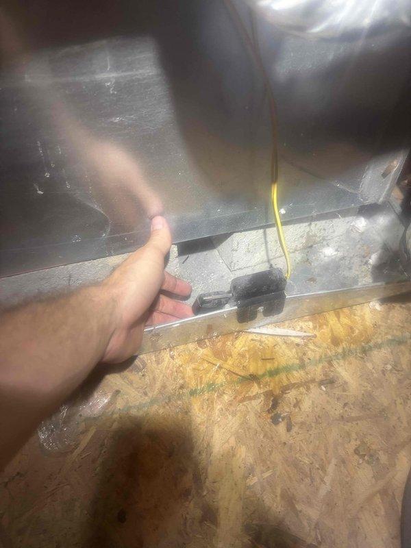 Responded to no cooling complaint on upstairs system of dual-zone residence with 8-year-old equipment. Upon inspection, found evaporator coil severely frozen with ice buildup, preventing proper airflow and heat exchange. Advised customer to power down system to allow complete thaw of coil and insulation. Observed moisture damage to surrounding insulation and identified potential airflow restriction or refrigerant issue requiring follow-up diagnostic once coil defrosts.