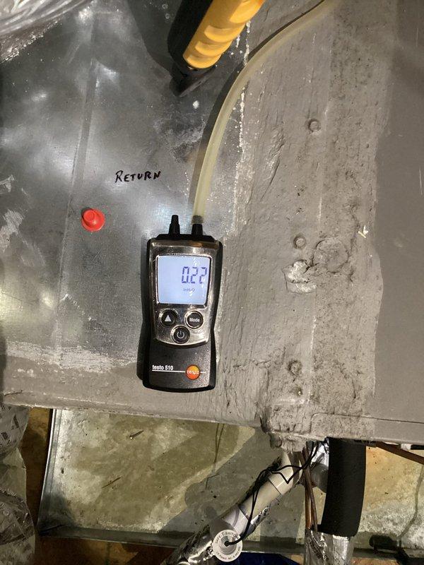 # HVAC Humidity Control Follow-Up

Responded to callback regarding persistent high indoor humidity levels reading at 60%. Previous technician had attempted to address the issue, but homeowner reported no improvement in humidity trends. 

Performed comprehensive system diagnostics using calibrated digital instruments. Measured static pressure readings on both supply and return air plenums using Testo 510 differential pressure gauge. Supply side registered 0.05" w.c. and return side measured 0.27" w.c., indicating potential airflow restrictions or system imbalance affecting dehumidification performance.

Inspected ductwork connections, refrigerant lines, and system components in mechanical space. Evaluated copper refrigerant piping routing and connections for proper installation and insulation. Assessed condensate drainage system operation to ensure proper moisture removal from evaporator coil.

Documented current system conditions with detailed measurements and photographic evidence of 