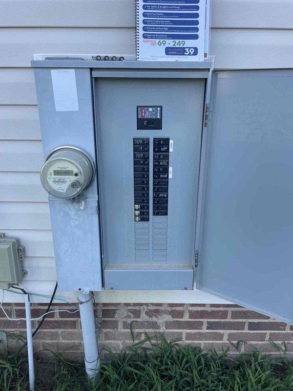 Performed diagnostic assessment of exterior lighting system at 2007-built residence. Evaluated three non-functional motion-sensor flood lights, inadequate garage-mounted fixture approximately 20 feet high requiring extended ladder access, and insufficient back door lighting. Inspected electrical panel and circuit breaker configuration to verify power supply to exterior lighting circuits. Provided recommendations for high-lumen replacement fixtures to address brightness deficiencies at garage and back door locations.