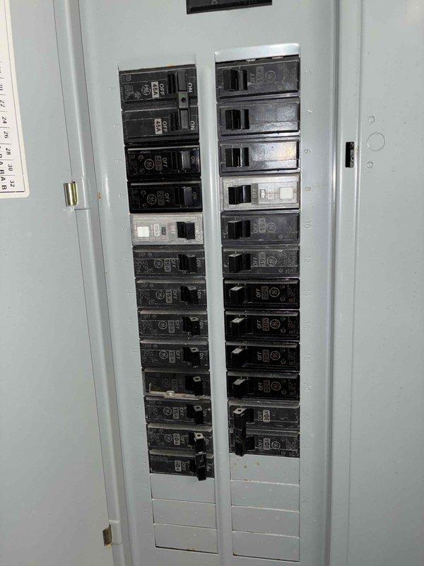 Conducted sales consultation for complete HVAC system replacement on two-unit residential property with equipment over 10 years old. Confirmed evaporator coil leak on second floor unit and documented existing electrical panel and installation measurements for replacement system specifications.