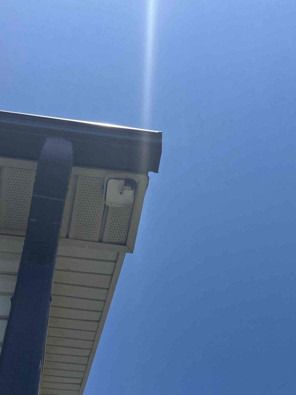 Responded to lightning strike damage at residential property. Replaced exterior flood light fixture at corner of house that was destroyed and knocked to ground by direct lightning strike. Inspected and replaced damaged interior switch that had sustained electrical damage (evidenced by charring/discoloration) while adjacent switches on same circuit remained operational. Verified proper grounding and circuit integrity throughout affected area to ensure no additional hidden damage from surge event.
