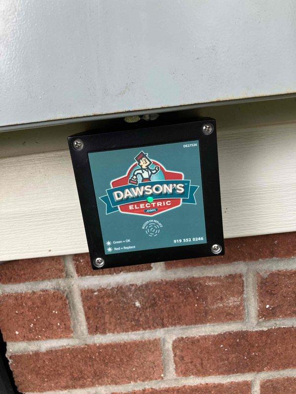 Responded to lightning strike damage at residential property. Replaced exterior flood light fixture at corner of house that was destroyed and knocked to ground by direct lightning strike. Inspected and replaced damaged interior switch that had sustained electrical damage (evidenced by charring/discoloration) while adjacent switches on same circuit remained operational. Verified proper grounding and circuit integrity throughout affected area to ensure no additional hidden damage from surge event.