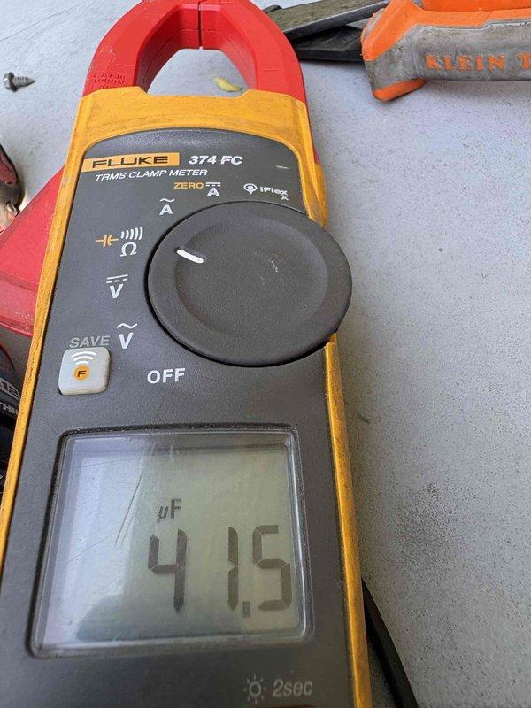 Completed comprehensive heating and air maintenance on 2017 system including 80-point inspection, outdoor coil cleaning, burner cleaning, gas pressure adjustments, and safety inspections. Addressed concern regarding upstairs unit struggling to maintain cooling during 90-degree ambient conditions; tested capacitor reading 41.5 μF and inspected attic-mounted electrical components and refrigerant lines. All system components evaluated and serviced per manufacturer specifications.