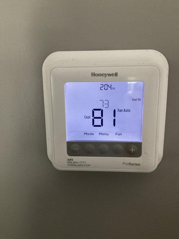 Responded to no cooling complaint on 9-year-old system. Found severely clogged air filter restricting airflow, causing inadequate cooling performance and rising indoor temperature. Replaced dirty filter with new filter, restored proper system operation, and verified thermostat showing active cooling cycle with unit maintaining setpoint.