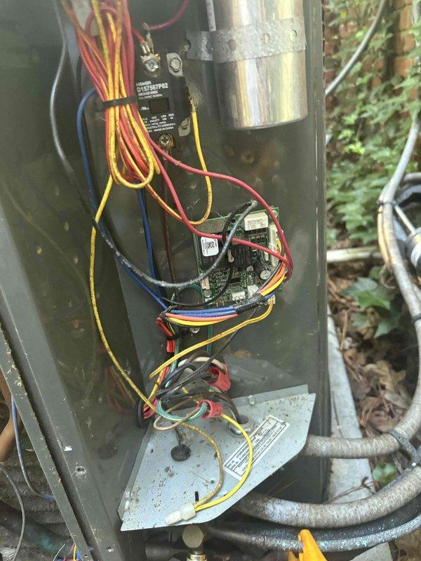 Performed system isolation and leak detection procedure on split HVAC system. Pumped down refrigerant from the system and performed nitrogen purge to isolate refrigerant leak between indoor and outdoor units, including line sets penetrating through wall assembly. Utilized dual-port manometer to monitor system pressures during diagnostic process. Accessed outdoor unit control panel to inspect electrical components and compressor assembly during troubleshooting procedure. Successfully completed system wash and pressure testing to identify leak location within refrigerant circuit.