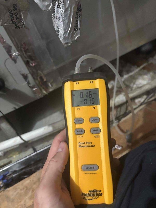 Performed system isolation and leak detection procedure on split HVAC system. Pumped down refrigerant from the system and performed nitrogen purge to isolate refrigerant leak between indoor and outdoor units, including line sets penetrating through wall assembly. Utilized dual-port manometer to monitor system pressures during diagnostic process. Accessed outdoor unit control panel to inspect electrical components and compressor assembly during troubleshooting procedure. Successfully completed system wash and pressure testing to identify leak location within refrigerant circuit.