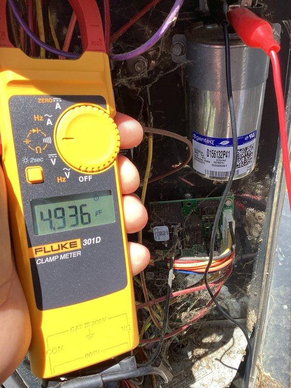 Responded to after-hours emergency call for AC not cooling. Upon arrival, performed electrical diagnostics on outdoor condensing unit. Tested compressor amperage draw using clamp meter, recording 145.5 amps. Identified failed run capacitor through capacitance testing with multimeter, which measured 49.36 µF on the Copeland-branded capacitor. Replaced defective capacitor, restored system to normal operation, and verified proper compressor amperage and cooling performance before departure.