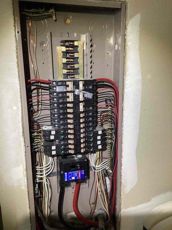 Completed comprehensive 32-point annual electrical system evaluation on residential property. Performed electrical panel maintenance including torque verification and connection inspection of all circuit breakers and bus bars. Conducted GFCI outlet and breaker testing throughout the residence to verify proper ground fault protection and trip functionality. Tested all AFCI breakers to ensure fire protection circuits were operating within specifications. Performed smoke detector and carbon monoxide detector maintenance including battery replacement and functional testing of all units. Replaced customer-supplied light bulbs in fixtures up to 12 feet and cleaned ceiling fans up to 12 feet. Inspected exterior meter installation and verified proper mounting and weatherproofing of service entrance equipment. Documented electrical panel configuration with digital monitoring device showing normal operating parameters. All safety devices tested and confirmed operational. System found to be funct