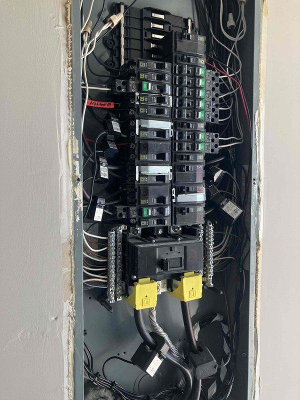 Conducted whole home generator consultation for 2024 construction property. Evaluated existing 200-amp electrical panel and discussed installation requirements for 22KW air-cooled Briggs and Stratton generator system with aluminum enclosure, including meter base modifications, 200-amp automatic transfer switch, load management devices, proper wiring, and permit coordination. Documented current electrical panel configuration and provided detailed proposal covering seven-year manufacturer warranty and three-year parts and labor warranty, noting gas line installation to be coordinated separately.